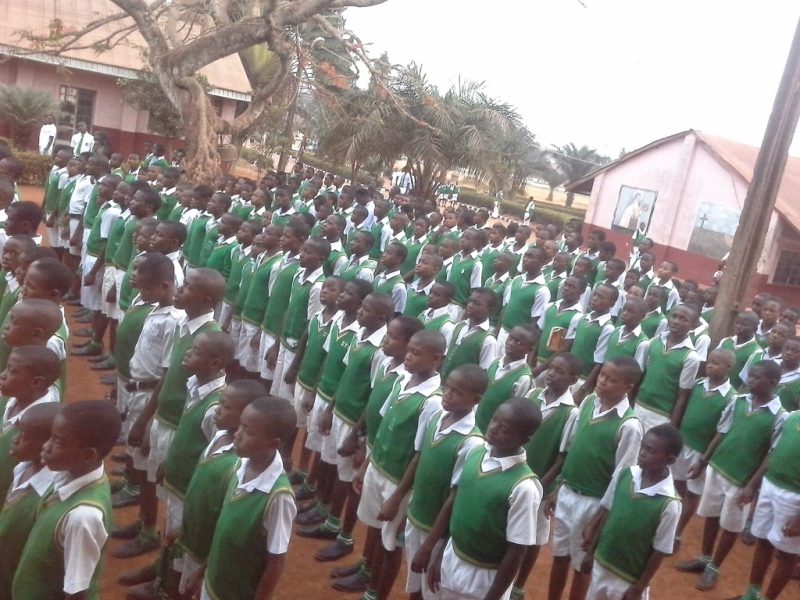 Students singing the anthem at assembly